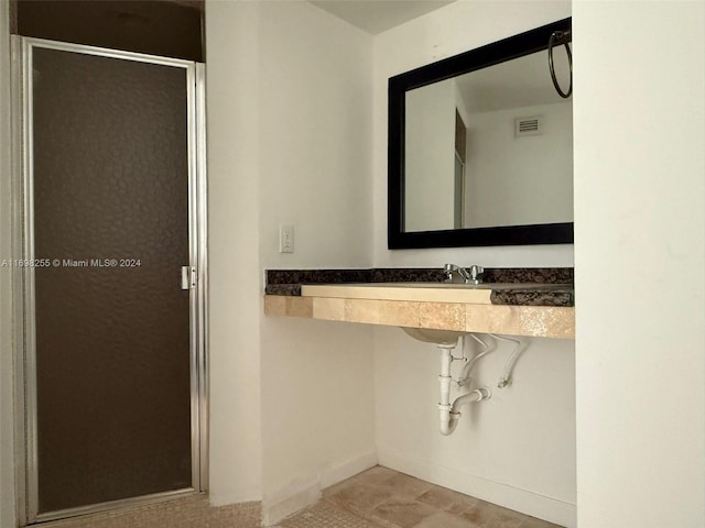 bathroom with an enclosed shower