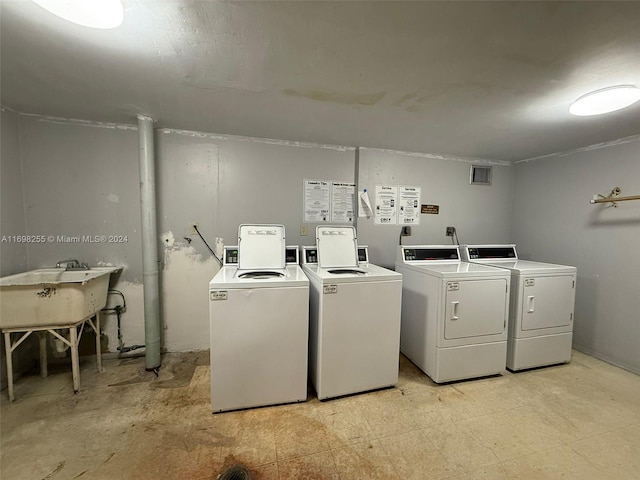 washroom featuring separate washer and dryer and sink