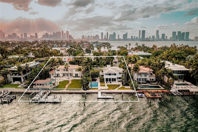 birds eye view of property featuring a water view