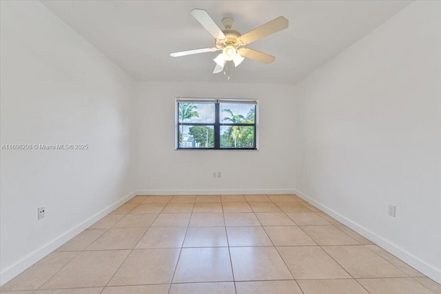 unfurnished room featuring ceiling fan and light tile patterned flooring