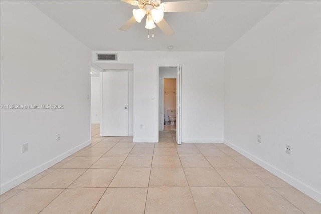 spare room with light tile patterned floors and ceiling fan