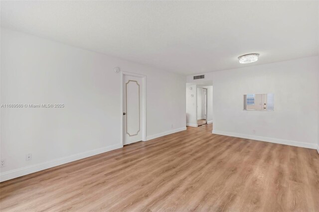 empty room featuring light hardwood / wood-style flooring