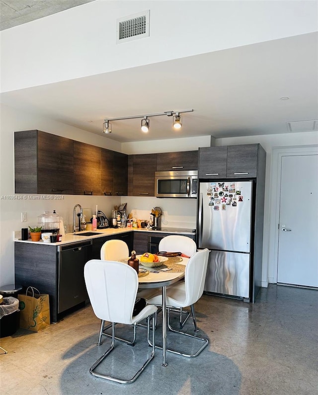 kitchen with appliances with stainless steel finishes and sink