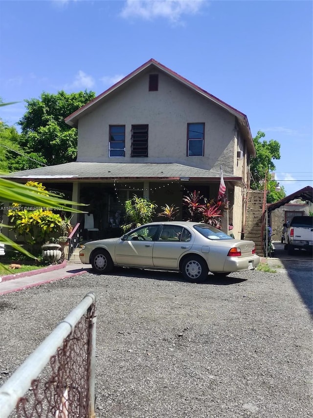 view of front of home with a carport