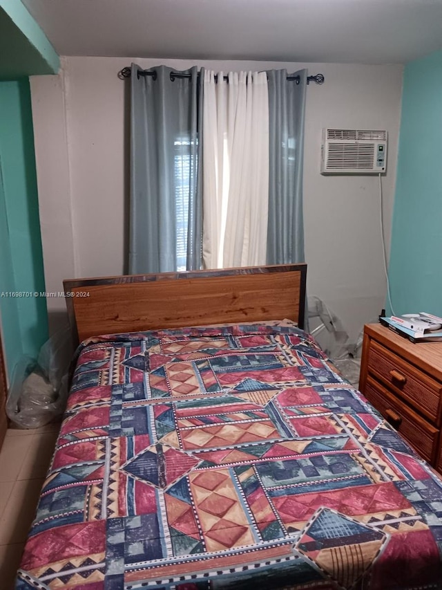 bedroom with a wall mounted air conditioner