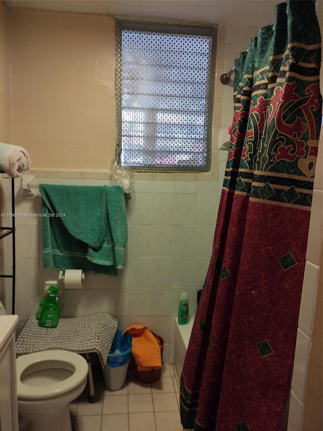 full bathroom with tile patterned flooring, vanity, toilet, and tile walls