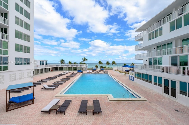 view of swimming pool with a patio area