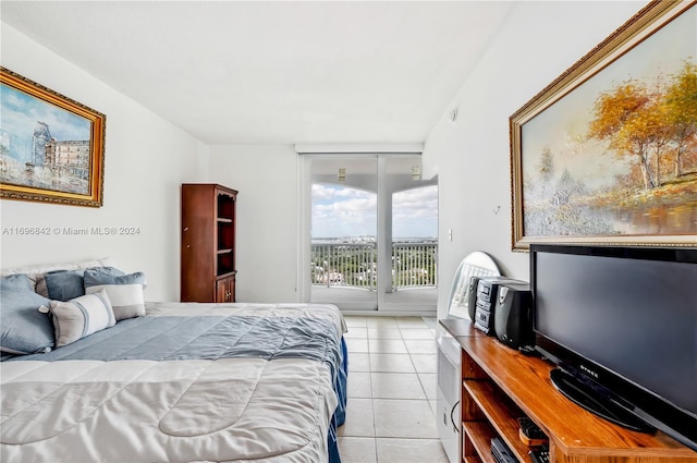 bedroom with access to outside and light tile patterned flooring