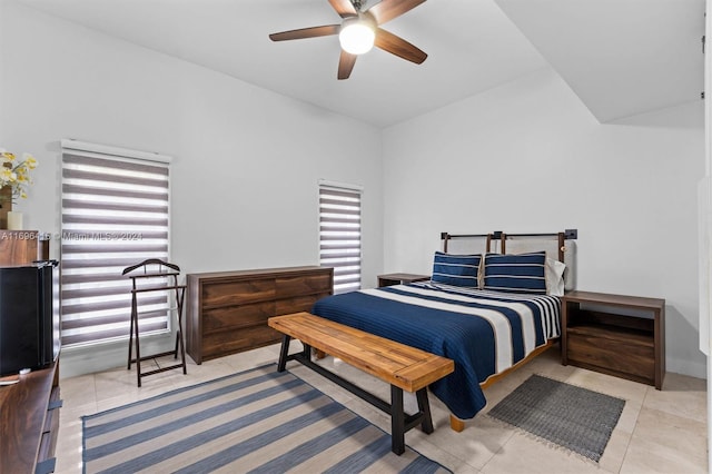 tiled bedroom with ceiling fan