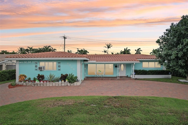 view of front of property with a yard