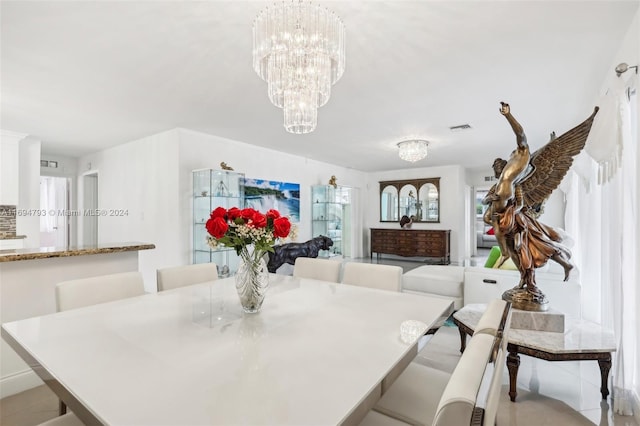 dining space with a chandelier and a healthy amount of sunlight