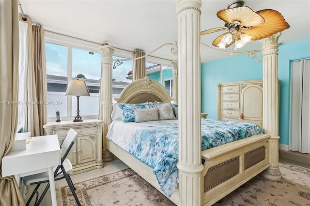 bedroom with light hardwood / wood-style floors and ceiling fan