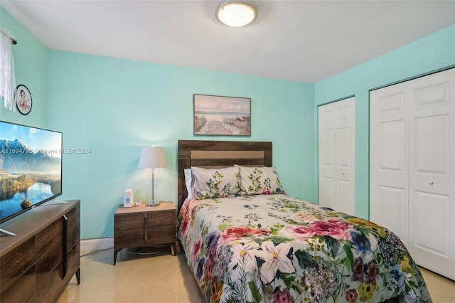 bedroom featuring multiple closets