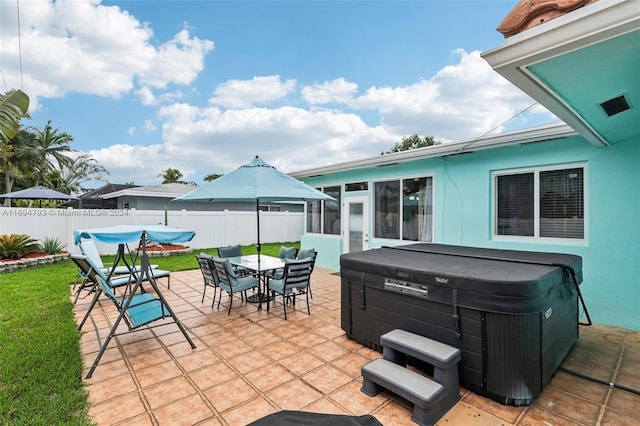 view of patio with a hot tub