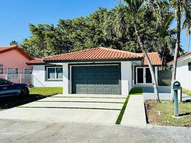 mediterranean / spanish-style house featuring a garage