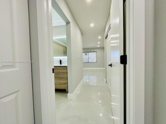 corridor with light tile patterned floors