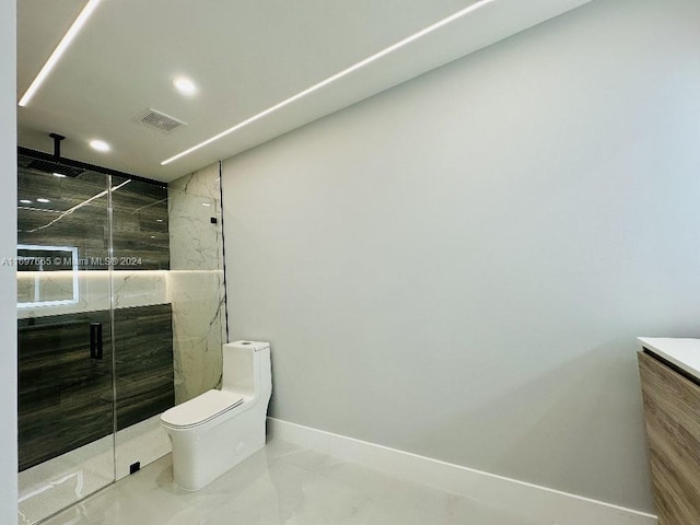 bathroom with an enclosed shower, vanity, and toilet