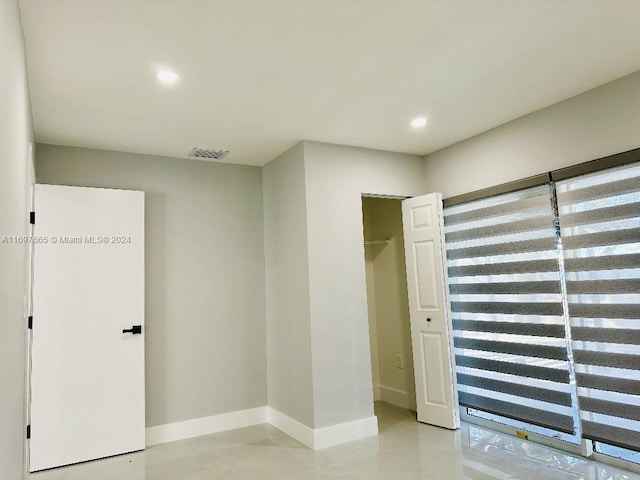 unfurnished bedroom with a closet