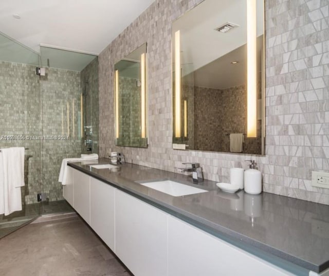 bathroom featuring tasteful backsplash, walk in shower, vanity, tile walls, and concrete floors