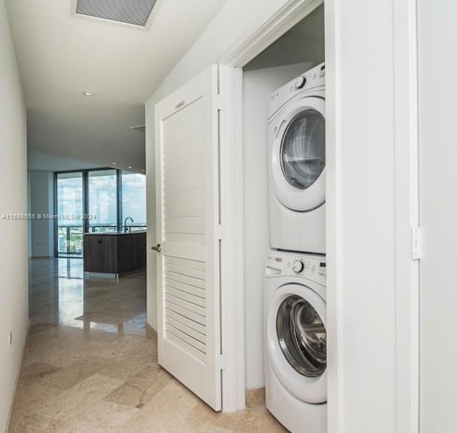 laundry room featuring stacked washing maching and dryer