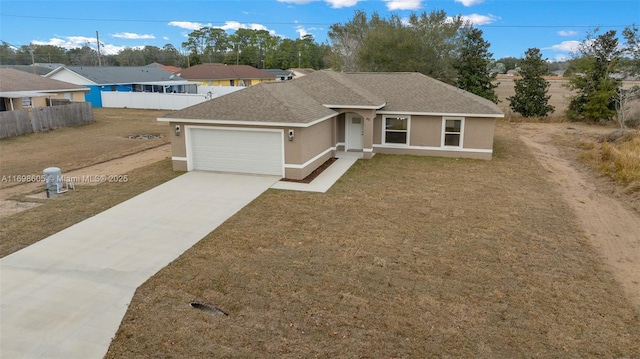 ranch-style home featuring a front yard and a garage