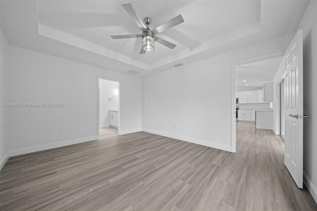 full bathroom with vanity, toilet, tiled shower / bath, and hardwood / wood-style flooring