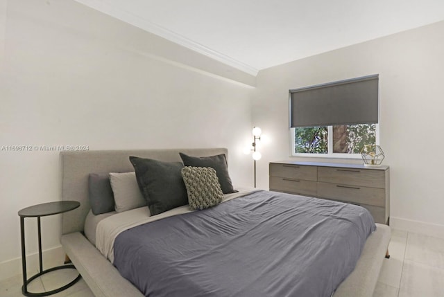 tiled bedroom with ornamental molding