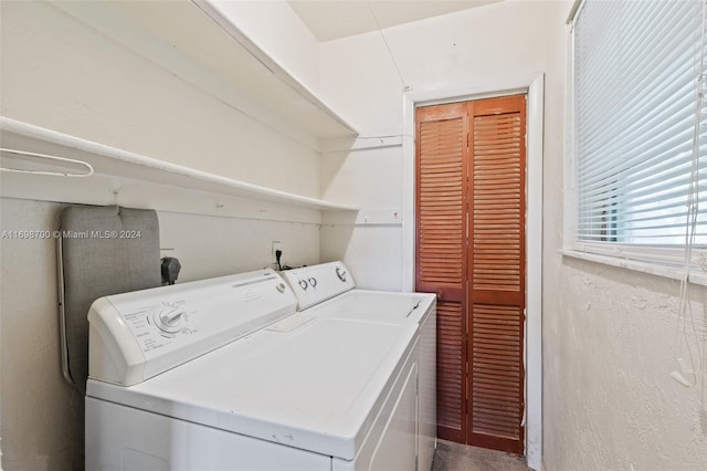 laundry room featuring washing machine and clothes dryer