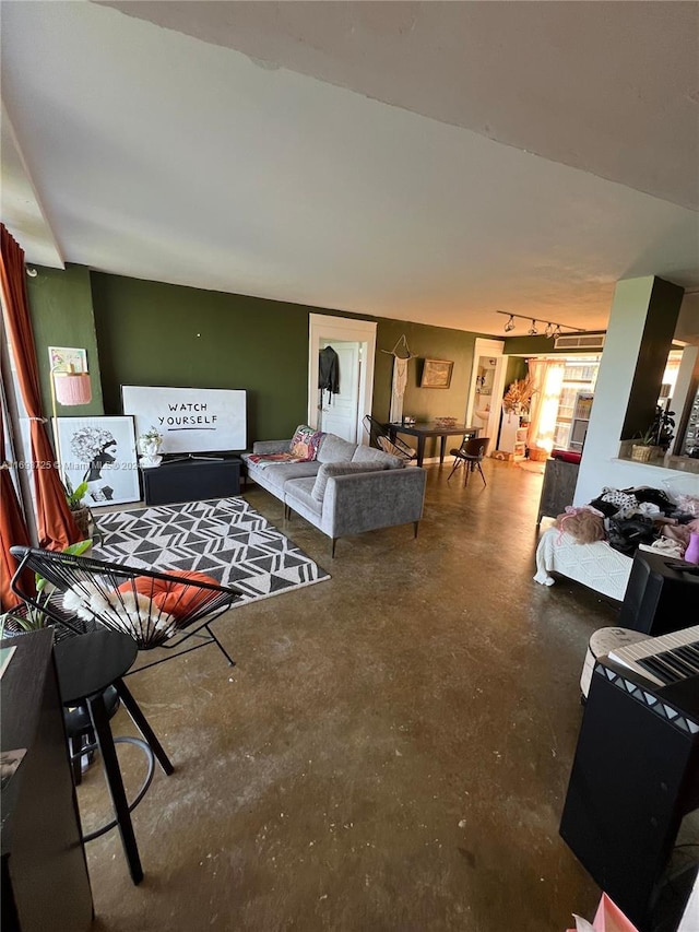 living room featuring concrete flooring