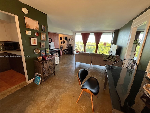 living room featuring concrete flooring