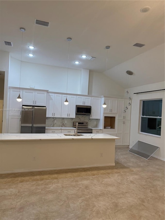 kitchen with pendant lighting, a spacious island, decorative backsplash, white cabinetry, and stainless steel appliances