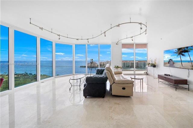 living room with expansive windows and track lighting