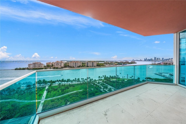 balcony featuring a water view