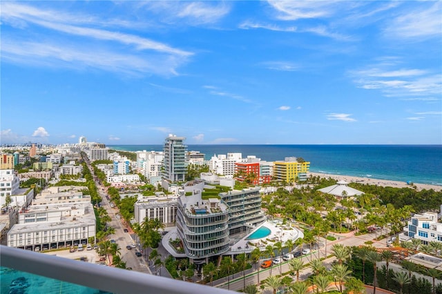 drone / aerial view with a water view and a view of the beach