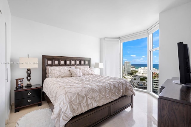 bedroom featuring floor to ceiling windows and access to outside