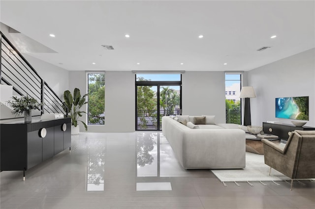 909 NE 16th Ter Unit 2, Fort Lauderdale, FL 33304 - living room featuring recessed lighting, tile patterned floors, and stairs