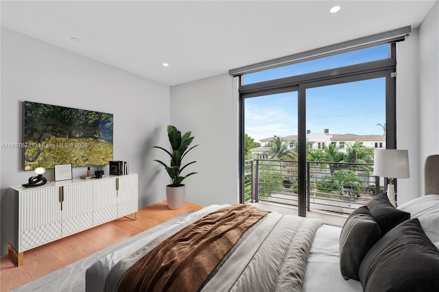 909 NE 16th Ter Unit 2, Fort Lauderdale, FL 33304 - bedroom with wood finished floors, recessed lighting, and floor to ceiling windows