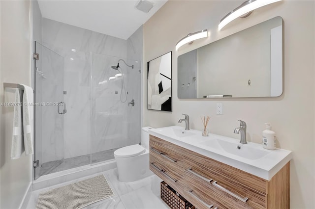 bathroom featuring vanity, toilet, and walk in shower