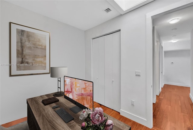 909 NE 16th Ter Unit 2, Fort Lauderdale, FL 33304 - office area with wood finished floors and a skylight