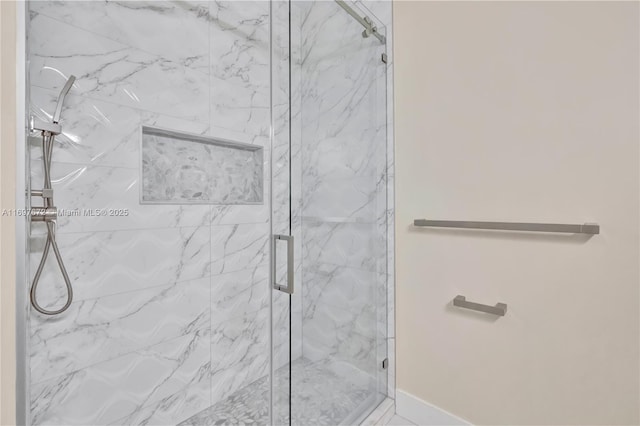 909 NE 16th Ter Unit 2, Fort Lauderdale, FL 33304 - bathroom featuring a marble finish shower