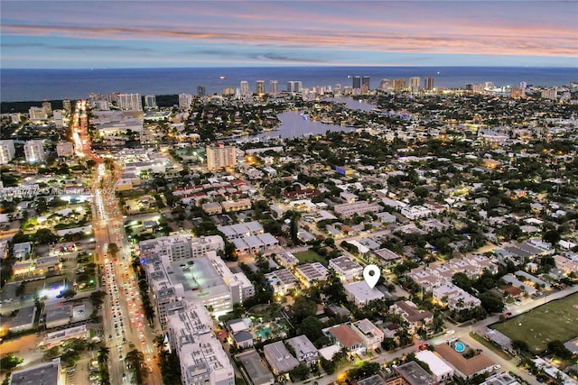 aerial view at dusk with a water view