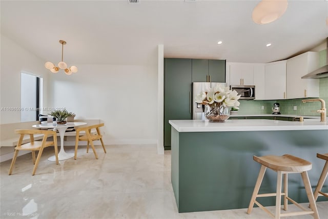14584 SW 115th St, Miami, FL 33186 - kitchen featuring stainless steel appliances, light countertops, decorative backsplash, a peninsula, and recessed lighting