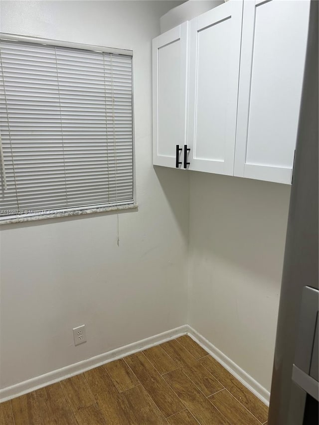 washroom with dark hardwood / wood-style flooring