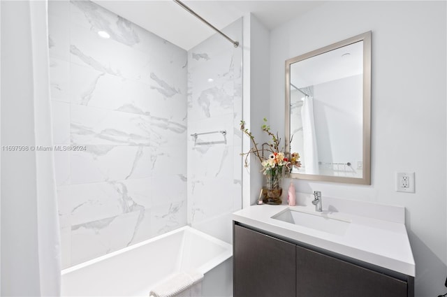 bathroom featuring vanity and tiled shower / bath combo