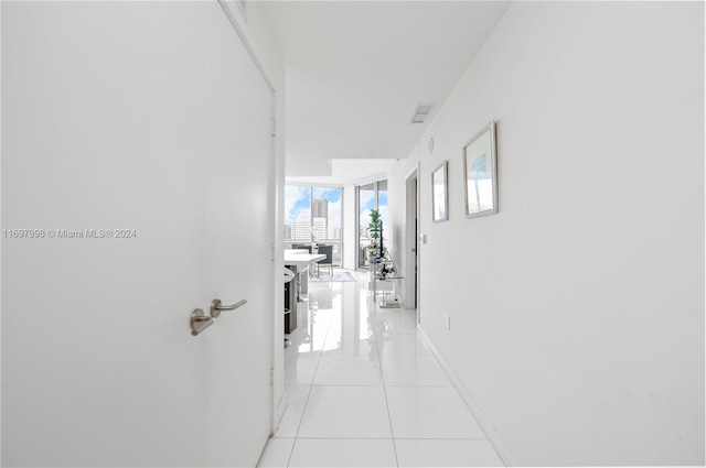 hallway featuring light tile patterned floors