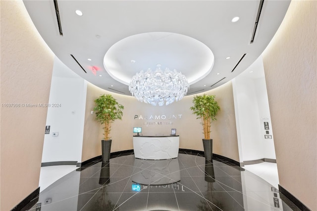 reception area featuring a chandelier