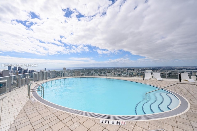 view of swimming pool featuring a patio area