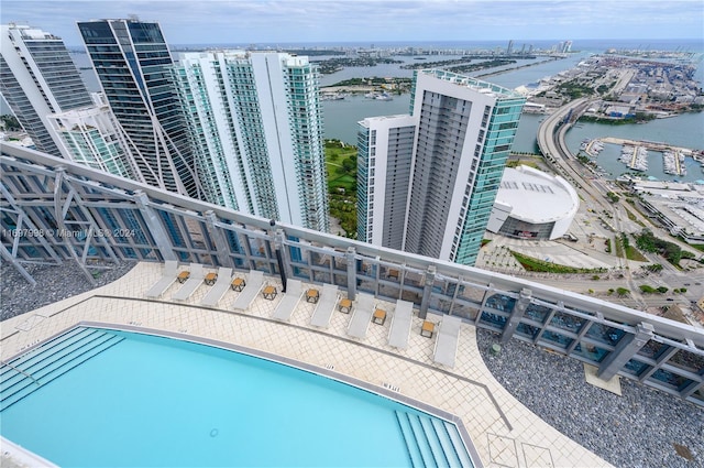 view of pool with a water view