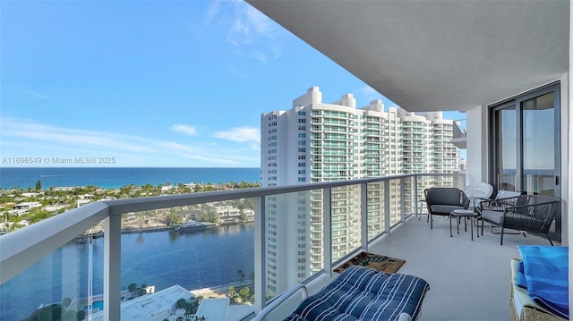 balcony featuring a water view