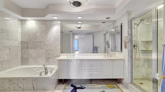 bathroom featuring vanity and separate shower and tub